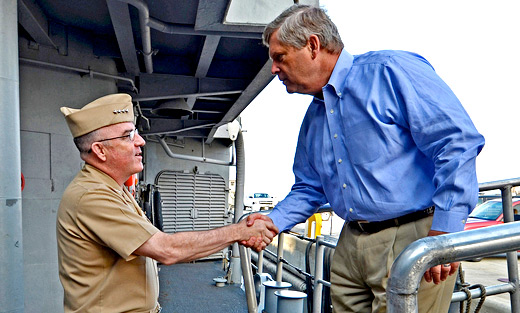 U.S. Navy Fleet Forces commander Admiral John C. Harvey, Jr. greets Secretary Vilsack during a tour of the guided- missile cruiser. Navy photo Rafael Martie.
