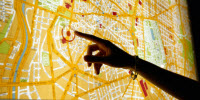 Person pointing to a map