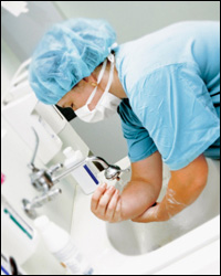 Photo: A healthcare professional washing her hands.