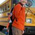Boy getting on school bus: Copyright iStock Photos