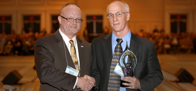 NAIC President and Florida Insurance Commissioner Kevin M. McCarty (left) with Joseph Fritsch (right) of the New York State Department of Financial Services.