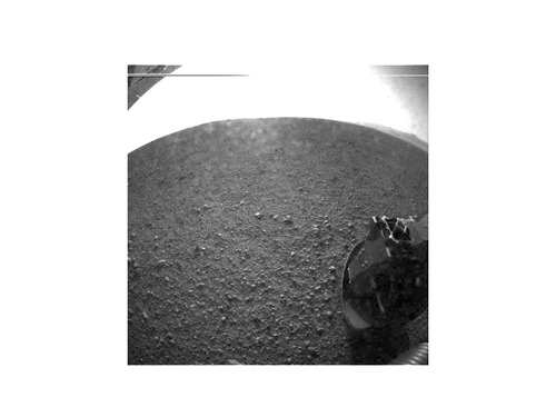 Image description: This is one of the first images taken by NASA’s Curiosity rover, which landed on Mars the evening of Aug. 5 PDT (morning of Aug. 6 EDT). It was taken through a “fisheye” wide-angle lens. As planned, the rover’s early images are lower resolution. Larger color images from other cameras are expected later in the week.
View more images from Curiosity.
Image from NASA/JPL-Caltech