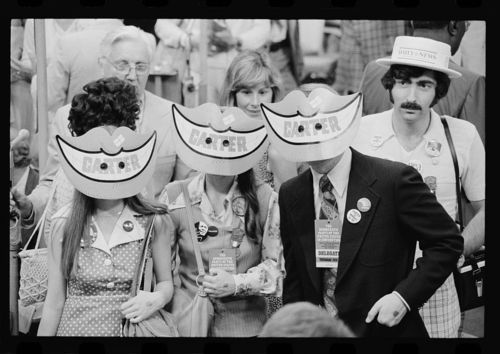 Image description: Political party conventions happen every four years. This photo is from the 1976 Democratic National Convention in New York City. The delegates are wearing Jimmy Carter smile masks.
View more images from political conventions, including illustrations from the humor and satire magazine Puck.
Photo by Warren K. Leffler, U.S. News &amp; World Report, from the Library of Congress Prints and Photographs Division