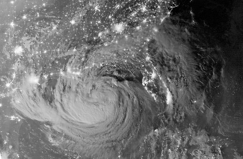 Image description: Hurricane Isaac approaches the gulf coast of the United States at night.
President Obama has signed emergency declarations for Mississippi and Louisiana. If you, or someone you know is in the path of the storm, here is some useful safety information from the White House blog:

Driving through a flooded area can be extremely hazardous. Almost half of all flash flood deaths happen in vehicles. When in your car, look out for flooding in low lying areas, at bridges, and at highway dips. As little as six inches of water may cause you to lose control of your vehicle. Remember – turn around, don’t drown.
The National Weather Service is the official source for weather information and severe weather watches and warnings, so follow your forecast at http://www.weather.gov/ on your computer orhttp://mobile.weather.gov/ on your phone.
Rain and storm surge may make flooding possible. Here are the definitions of the types of advisories officials may issue:
Flood Watch: Flooding is possible. Tune in to NOAA Weather Radio, commercial radio, or television for information.
Flood Warning: Flooding is occurring or will occur soon; if local officials give notice to evacuate, do so immediately.
Flash Flood Watch: Rapid rises on streams and rivers are possible. Be prepared to move to higher ground; listen to NOAA Weather Radio, commercial radio, or television for information.
Flash Flood Warning: Rapid rises on streams and rivers are occurring; seek higher ground on foot immediately.
The U.S. Department of Agriculture is urging everyone to make food safety a part of their preparation efforts:
Store food on shelves that will be safely out of the way of contaminated water in case of flooding.
Group food together in the freezer — this helps the food stay cold longer.
Have coolers on hand to keep refrigerator food cold if the power will be out for more than 4 hours.
Finally, if the high winds and rain from Isaac cause the power to go out, remember these tips:
Keep refrigerator and freezer doors closed as much as possible.
A refrigerator will keep food cold for about 4 hours if you keep the door closed.
A full freezer will keep its temperature for about 48 hours (24 hours if half-full).

Image credit: NASA Earth Observatory.