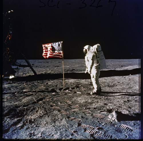 From the U.S. Presidential Libraries:

First moon walk.  July 20, 1969. 
Photo of Astronaut Edwin E.  “Buzz” Aldrin on the surface of the moon, next to the U.S. flag.  Photographed by Neil Armstrong, first person to set foot on the moon.  Apollo 11 mission.
-via The National Archives, Nixon Administration
