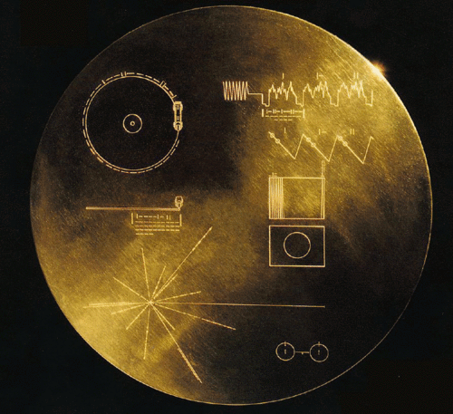 Image description: NASA spacecrafts Voyager 1 and 2 both carry this 12-inch gold-plated phonograph record containing sounds and images of life on Earth &#8212; just in case they encounter intelligent life.
The figures on the record explain the origin of the spacecraft and indicate how the record is to be played. The contents of the record, chosen by a committee chaired by the late astronomer Carl Sagan, include music, greetings, biological information, animal sounds, and more. The record even includes brain waves of a young woman in love, committee member Ann Druyan. Druyan and Sagan had fallen in love while working together on the project.
The Voyager probes, launched in 1977 and by far the furthest reaching human-made objects, are now at the edge of the solar system. Voyager 1 is over 18 billion kilometers from the Sun, even further away than Pluto. In fact, the craft is reaching the end of the Sun&#8217;s influence and is predicted to enter interstellar space around 2015. Both crafts have the batteries to transmit discoveries until about 2020.
Find out what the inscriptions on the Golden Record mean, the messages it contains, and more about the Voyager mission.