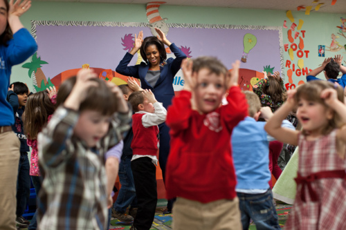 Image description: First Lady Michelle Obama participates in the &#8220;Bunny Pokey&#8221; song and dance with kids in the Kinderbees Activty Room at Penacook Community Center in Penacook, NH on March 9, 2012.
Photo by Lawrence Jackson, White House 