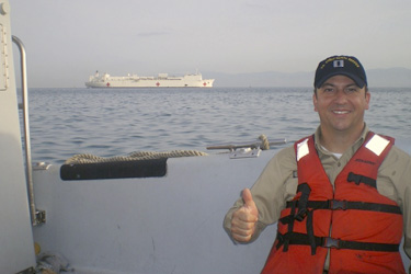LT Jason Mangum commuting to work from the USNS Comfort aboard the hospitality boat. Once ashore, he and other providers travel by bus to the University Hospital, Port-au-Prince, Haiti.