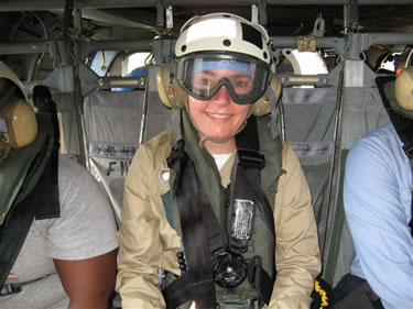 CAPT Cynthia Kunkel, USPHS environmental health officer, enjoying her ride as a passenger aboard one of the two helicopters (Painkiller 51 and 44) assigned to the USNS Comfort.