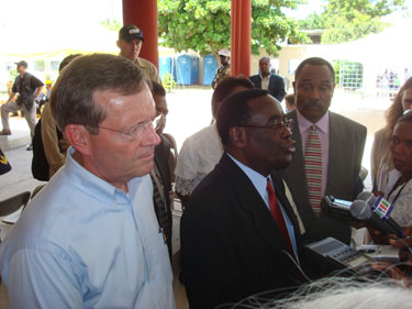 Secretary Mike Leavitt and Haiti Minster of Health Robert Auguste answer questions at a press conference at the University Hospital de la Paix in Port-au-Prince, Haiti.