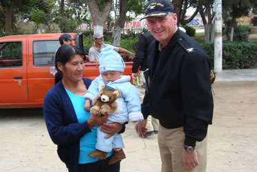 CAPT Shepherd and his fellow officers distributed stuff animals in a rural community near Trujillo, Peru. They toys were a great hit among the Peruvian children.