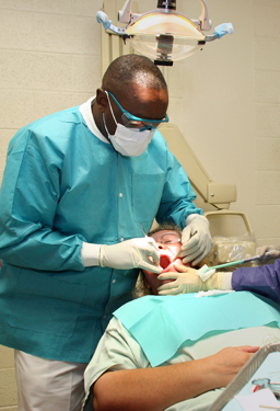 United States Public Health Service Commissioned Corps dentist working on a patient