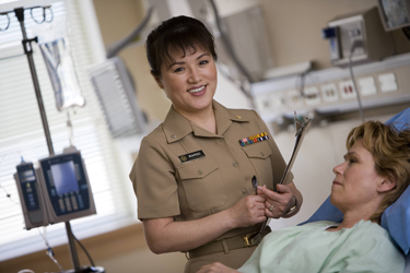 United States Public Health Service Commissioned Corps nurse with a patient
