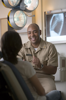 United States Public Health Service Commissioned Corps nurse speaking with a patient