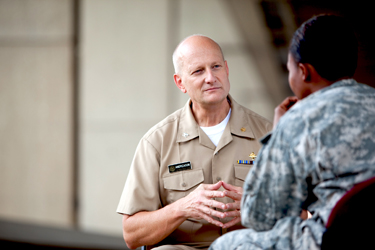 United States Public Health Service Commissioned Corps physician, CAPT Paul Anderson, speaking with a patient