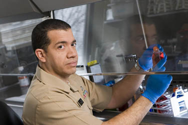 United States Public Health Service Commissioned Corps scientist working in the lab.