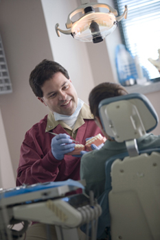 United States Public Health Service dentist speaking with a patient