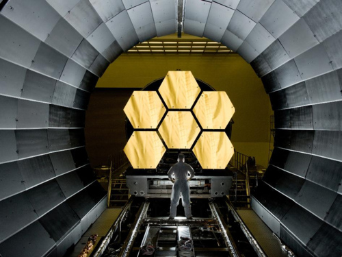 Image description: NASA engineer Ernie Wright looks on as the first six mirror segments from the James Webb Space Telescope are prepped to begin final cryogenic testing at NASA&#8217;s Marshall Space Flight Center.
Photo by David Higginbotham, NASA