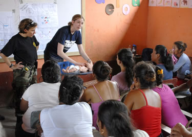 CDR Kimberly Elenberg is a Commissioned Corps nurse officer assigned to Office of Force Readiness and Deployment.  CDR Elenberg is shown here at the Santa Isabel school teaching over 300 community members of the importance of basic public health measures ranging from hand-washing, oral health, maternal and child health to sanitation practices.