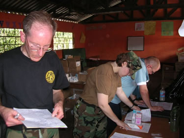 LCDR Steven Labrozzi, a pharmacist, reviews a prescription for a patient at the Huacho clinic in Peru.