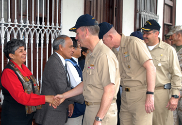 photo: CAPT Peter Dallman and CAPT Dean Coppola shake hands with the Governor of Huacho, Peru, during the opening ceremony of Operation Continuing Promise.