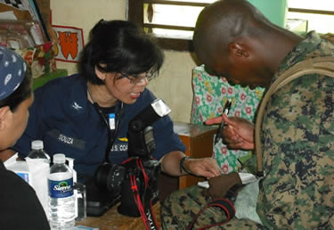 Photo:  CAPT Josephina Souza, a physician, conducts a patient interview at a Pacific Partnership medical civic action program at Buldon Central Elementary School.