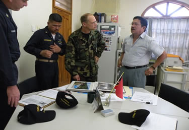 Photo: LCDR Andrew Sallach, a civil engineer, meets with the Minister of Infrastructure, Water, and Sanitation Services at the central water treatment plant for the City of Dili.
