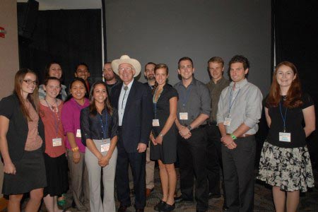Secretary Salazar poses for a photo with University of Colorado students.