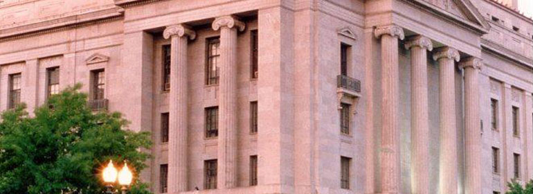 Photograph taken at dusk of the Department of Justice building