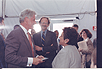 President Bill Clinton speaking with HHS Secretary Donna Shalala and NIH Director Dr. Harold Varmus after the cornerstone dedication ceremony for the Dale and Betty Bumpers Vaccine Research Center on June 9, 1999.