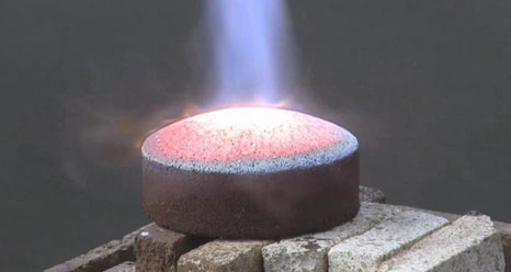 A brick of regolith heat shield material is heated in testing.