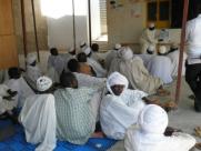 A local Muslim leader educates men in a Chad refugee camp about family planning