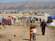 Uprooted Iraqis in a makeshift settlement 