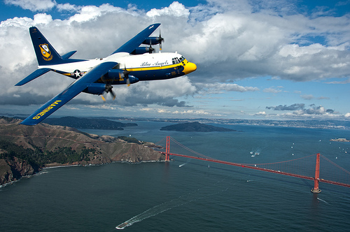 Image description: Fat Albert is a C-130 Hercules plane assigned to the U.S. Navy Flight Demonstration Squadron, the Blue Angels. In this picture, Fat Albert flies over  San Francisco in preparation for an air show scheduled during San Francisco Fleet Week.
Photo by Mass Communication Specialist 3rd Class Andrew Johnson, U.S. Navy.