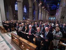 Attendees to the memorial service for Neil Armstrong sing a hymnal, Thursday, Sept. 13, 2012, at the Washington National Cathedral.