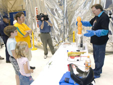Bryan Palaszewski demonstrating a balloon experiment.