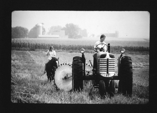 This historical photograph from the Emerson Brooks Collection at the National Agricultural Library shows a woman farming on a tractor. Farms contribute to many aspects of  our lives and provide the raw materials for many of our  everyday necessities.
Learn more about farms and how you can support local farmers with the U.S. Department of Agriculture&#8217;s Know Your Farmer, Know Your Food initiative.