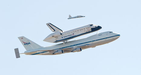 the Shuttle Carrier Aircraft with Endeavour attached and a chase aircraft