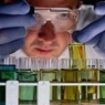 Man with test tubes in lab. 