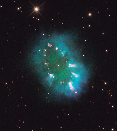 Image description: Located 15,000 light-years away in the constellation Sagitta, the Necklace Nebula is the glowing remains of an ordinary star.  It consists of a bright ring 12 trillion miles wide and is dotted with dense, bright knots of gas that resemble diamonds in a necklace. The Hubble telescope captured this image.
Photo by NASA