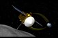 This is an artist's concept of the OSIRIS-REx spacecraft collecting a sample from asteroid 1999 RQ36. 