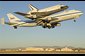 Photo of the space shuttle Endeavour atop its modified Boeing 747 carrier aircraft. 