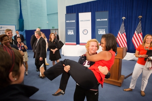 Image description: First Lady Michelle Obama is picked up by U.S. Olympic wrestler Elena Pirozhkova during a visit with Team USA Olympic athletes competing in the 2012 Summer Olympic Games.
View more photos from the First Lady&#8217;s trip to London.
Photo by Sonya N. Hebert, Official White House 