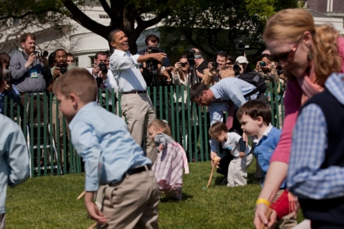 Image description: President Barack Obama reacts as children push eggs across the South Lawn of the White House during the annual Easter Egg Roll on Monday.
The White House Easter Egg Roll is an annual event, hosted by the President every Easter Monday. Families win tickets based on a lottery and get to enjoy games and fun on the White House grounds. Wooden eggs with the President and First Lady&#8217;s signatures are given out to all attendees.
View more photos from yesterday&#8217;s event.
Official White House Photo by Pete Souza