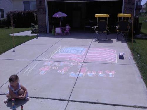 Image description: A young girl draws a mural on her driveway to greet visitors in Lincoln, Nebraska.
We asked you to share your best photos from your Fourth of July celebrations. Thanks to B. Curtin who shared this image with us on Twitter.