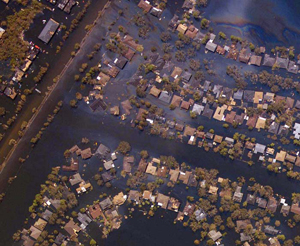Aerial photograph of flooded houses and roads.