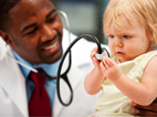 Copyrighted photo of a doctor with an infant patient.