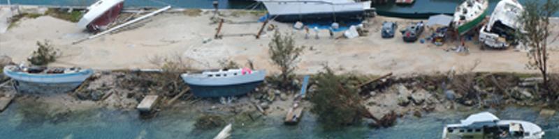 December 8th, 2002. The coastline is littered with small and large fishing boats, many have been thrown up on rocks and sand, while others have sunk to the bottoms of the shallow waters. 