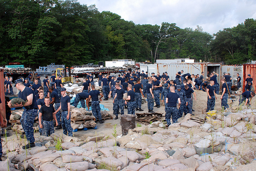 Image description: Sailors assigned to Naval Submarine Base New London place sandbags along the waterfront in preparation for Hurricane Irene.
Photo by Mass Communication Specialist 1st Class Peter D. Blair/U.S. Navy