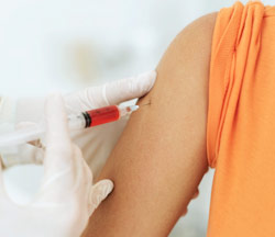 woman getting a shot in the arm